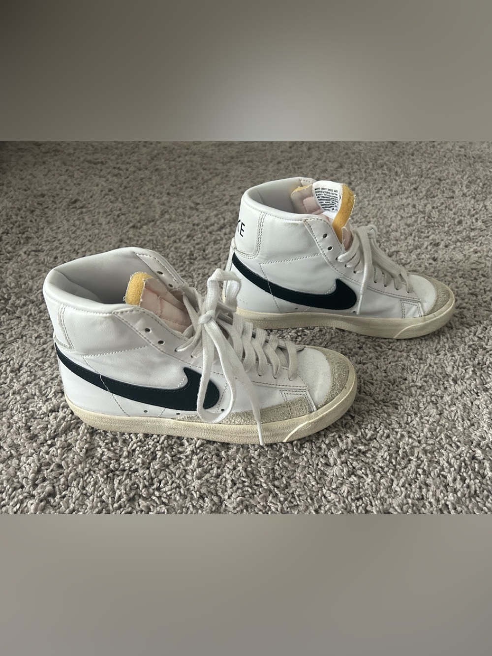 Girls Nike White High-Top Sneakers with Black Swoosh and Yellow Tongue. Size: 5Y